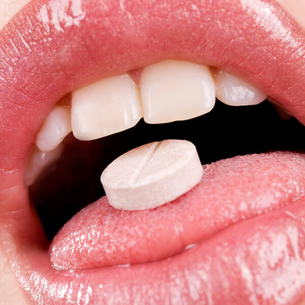 Tablet on tongue